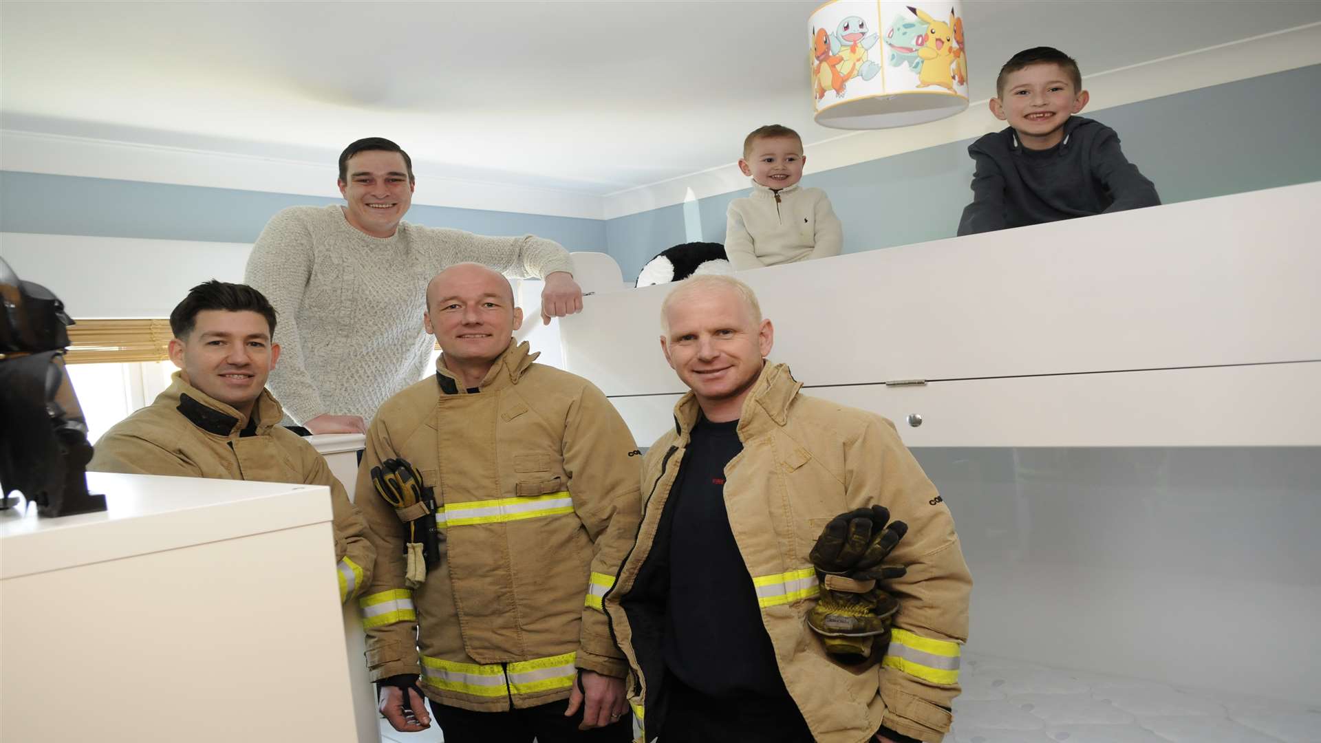 Draven Jefferies, eight, and Rogan, three, with Andy Bradley from Excaliber Carpentry and Joinery, Folkestone watch manager John Howard and firefighters Farrell Cox and Adam Eastwood