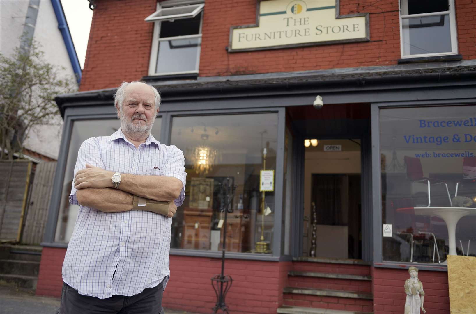 Owner David Bracewell outside his shop which police raided by mistake. Picture: Barry Goodwin