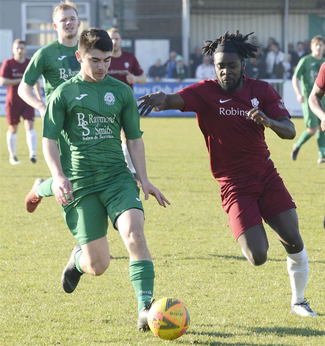 Canterbury's Bola Dawodu (right) prepares to make a challenge against Biggleswade Picture: Paul Amos