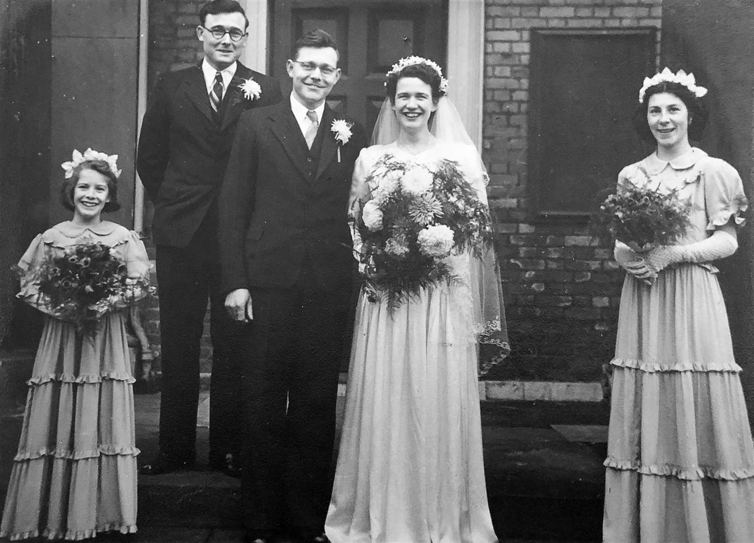 Georgina and Donald Williams' wedding at the Sheerness Dockyard Church, Blue Town, on Boxing Day 1950 with best man Donald's brother Leslie and bridesmaids, Glenys Jarvis, nine and Christine Hall, 17