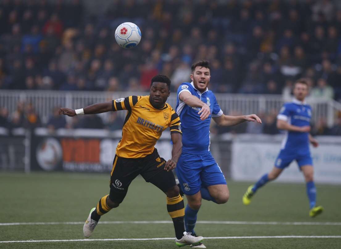 Maidstone striker Yemi Odubade works the North Ferriby defence Picture: Andy Jones