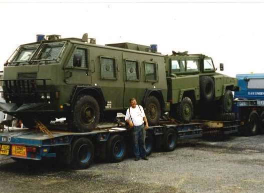Ronald Acott with a military vehicle loaded onto his lorry. Picture: Nicola Davis