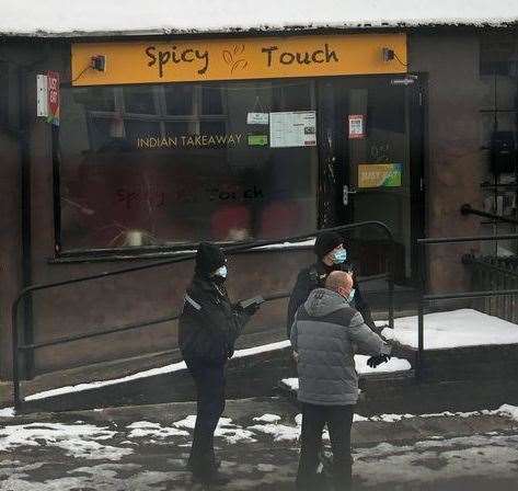 Police outside the Spicy Touch takeaway last year