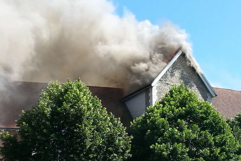 The fire is in the roof of a block of flats Picture: Julia Collins