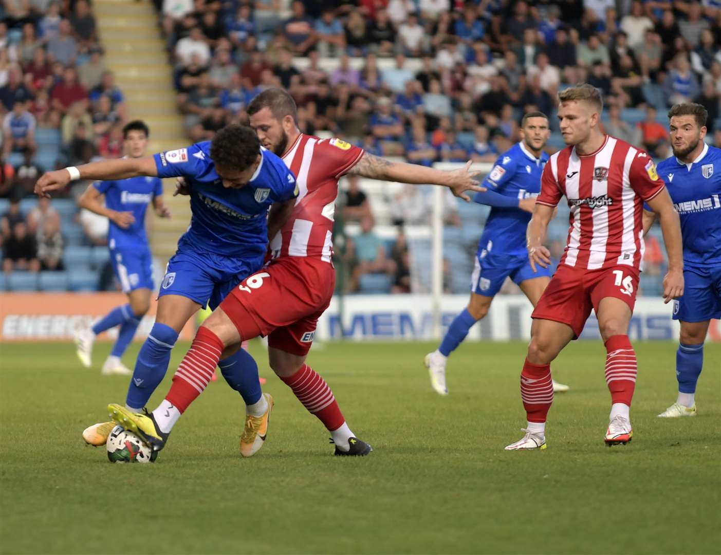Striker Lewis Walker is challenged during Gillingham's Carabao Cup tie against Exeter Picture: Barry Goodwin