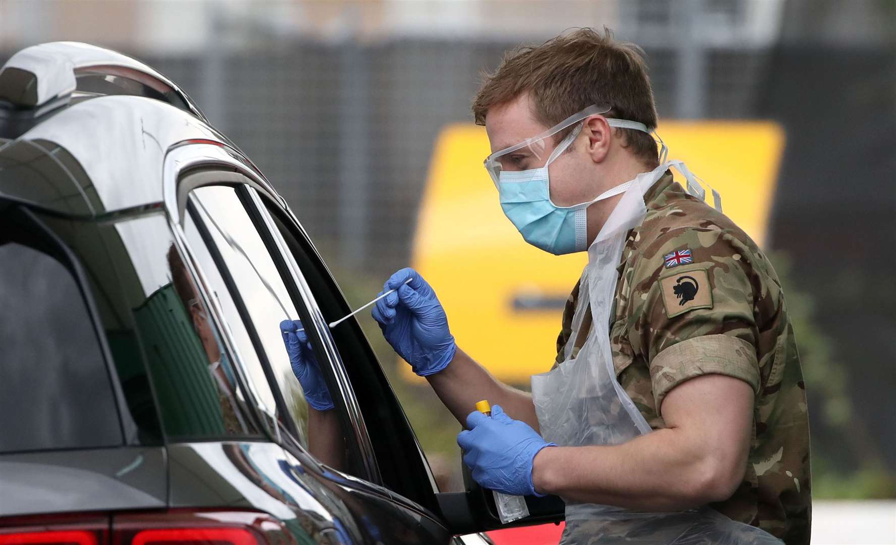 TESTING TIME: A member of the armed services carries out a swab to detect Covid-19