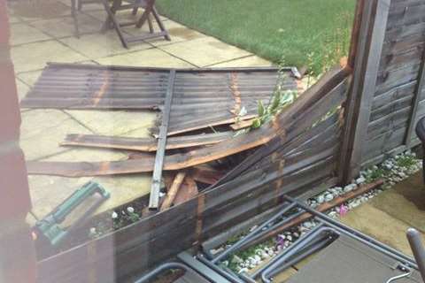 Smashed fence panels at a house on the Talmead estate