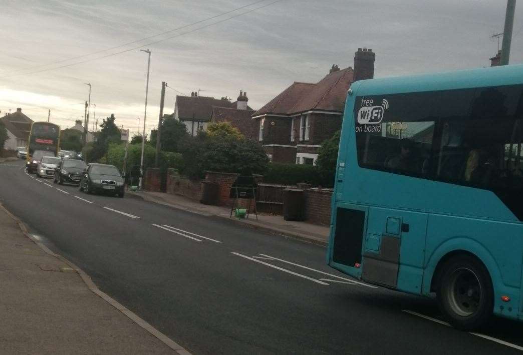 Traffic starts building up behind the stuck Arriva bus in Minster Road, Halfway. Another school bus can be seen in the queue further back. Picture: David Jones