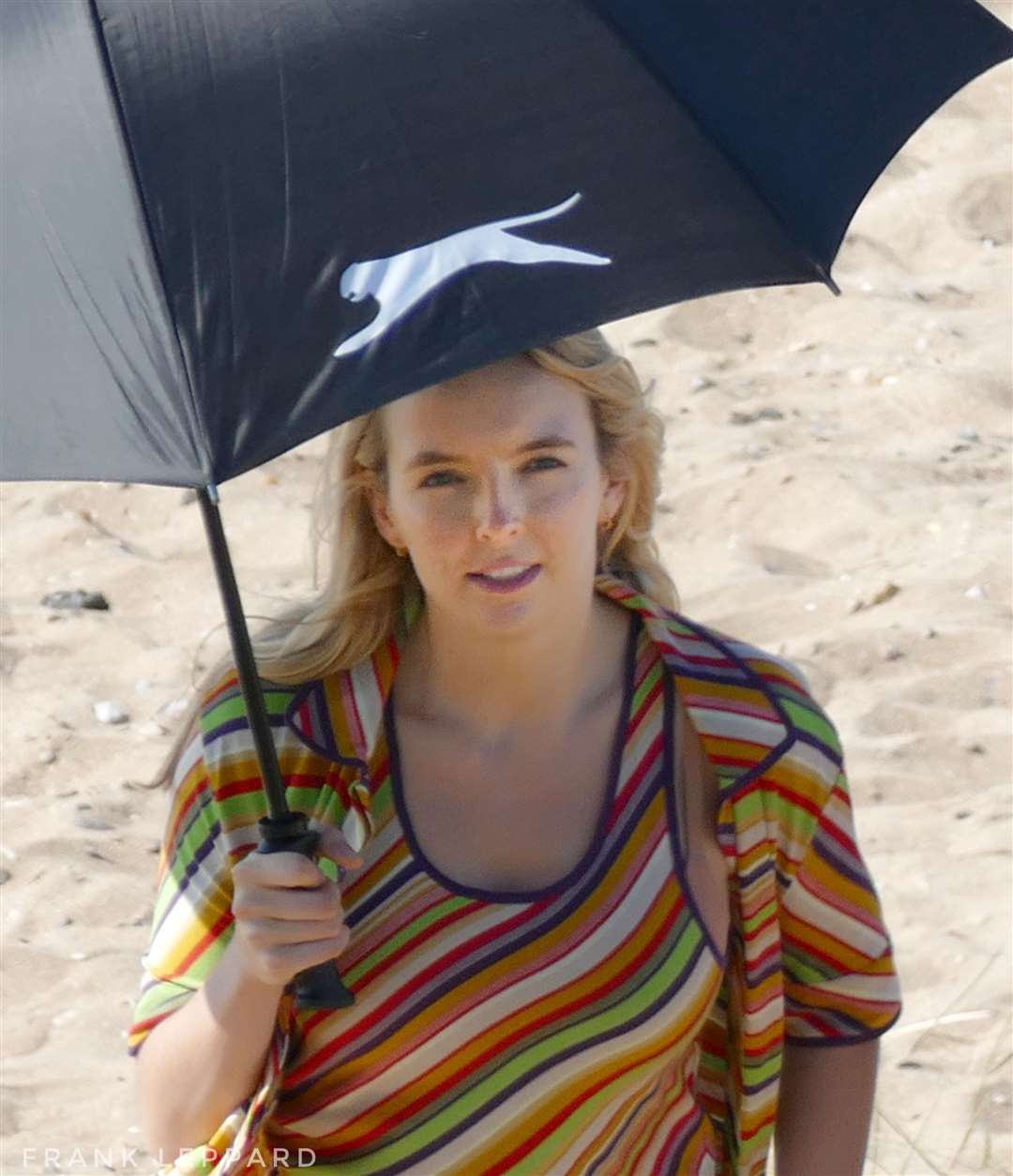 Jodie Comer gets some shade under an umbrella in Cliftonville, Margate. Picture: Frank Leppard Photography
