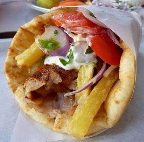 Real Greek food like this gyros is being cooked up