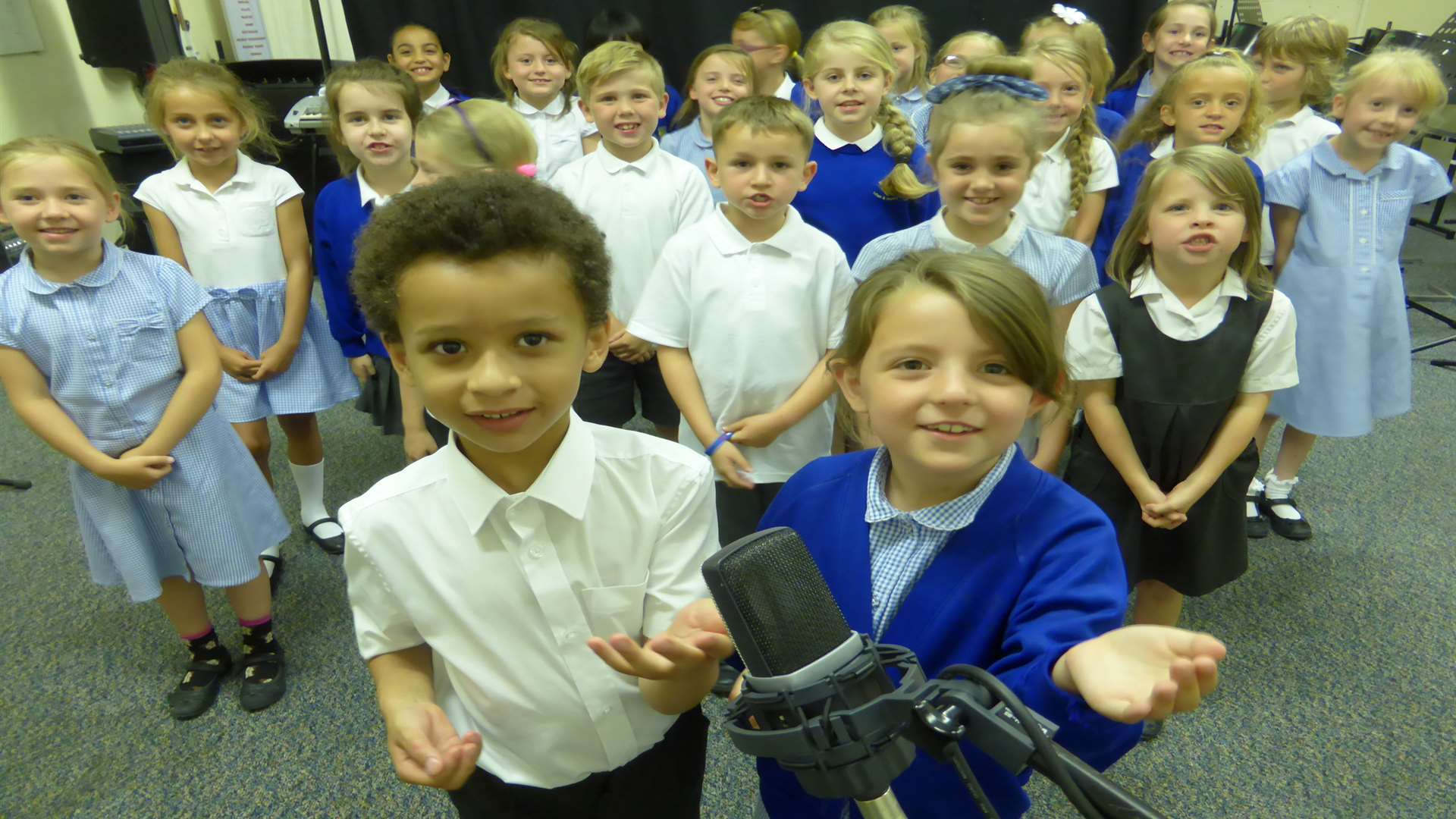 Pupils from Featherby Infants School, Gillingham, perform their version of Walking on Sunshine in the recording studio for the final of the KM Walk to School Song Contest.