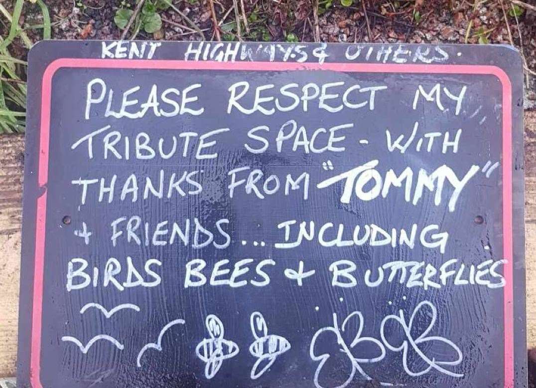 A polite notice was put on the green triangle to try to prevent damage to the tribute. Photo: Lesley Richards