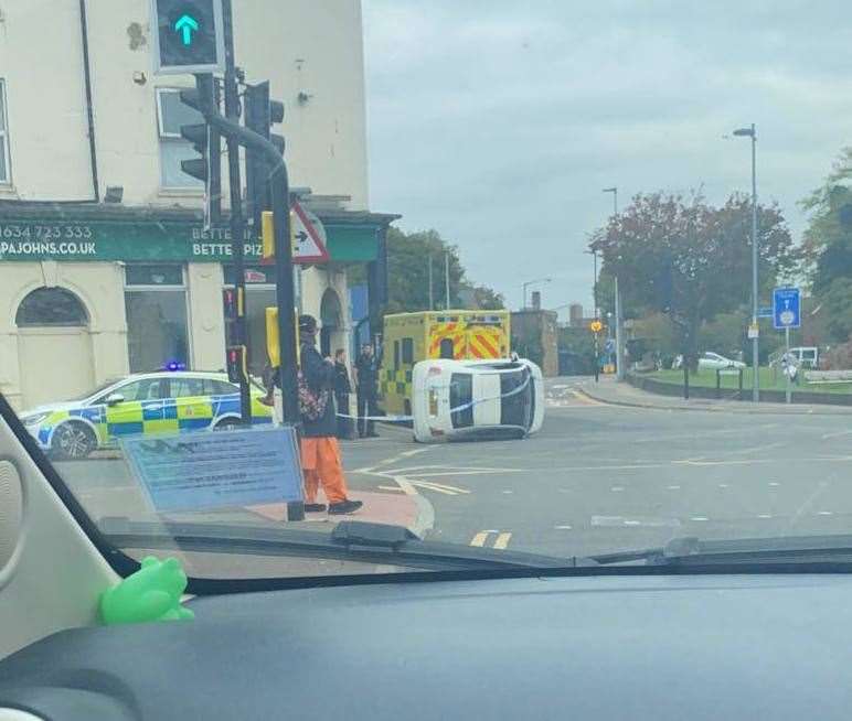 A car overturned after crashing into a metal bollard in London Road, Strood, near Papa John's Pizza takeaway. Picture: Liv Hopkins
