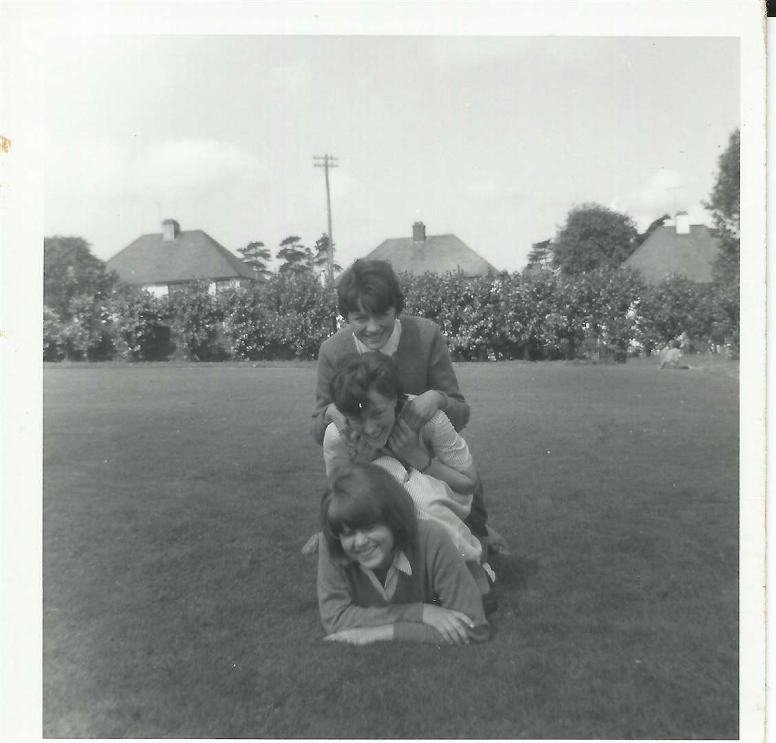 Margaret White (bottom), Helen Reid and Jane Turk on the lower playing field, looking towards Deakin Leas houses