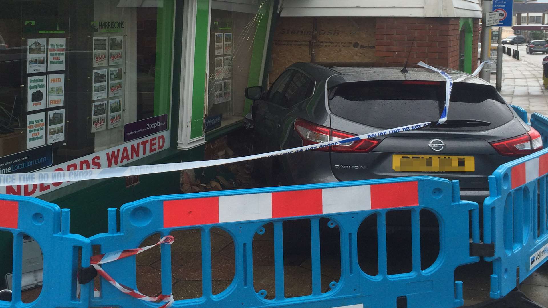 The car crashed into the shop front