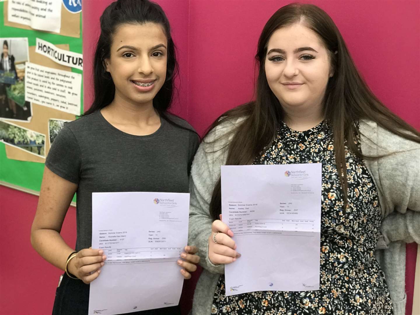 Rochelle Man (left) and Kes Rati (right) holding their exam results (15288580)