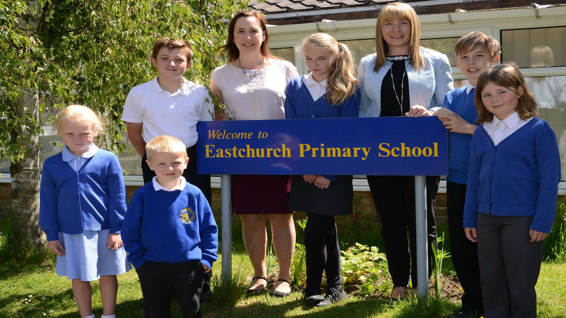 Head teachers Sarah Hunt and Michelle Crowe with some of the children from both school sites