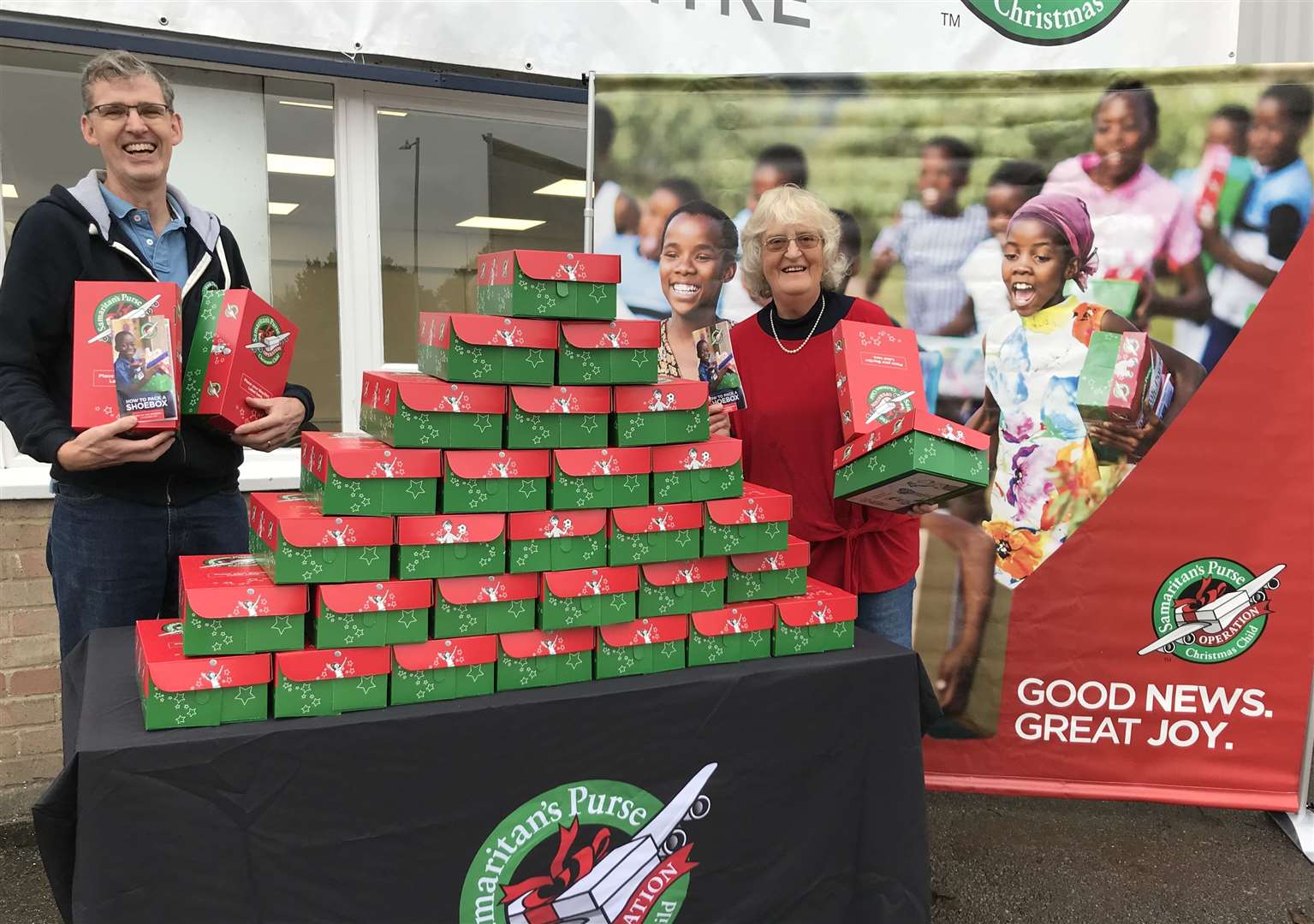 Operation Christmas Child director Nick Cole with volunteer Madeline McClintock Picture: Operation Christmas Child
