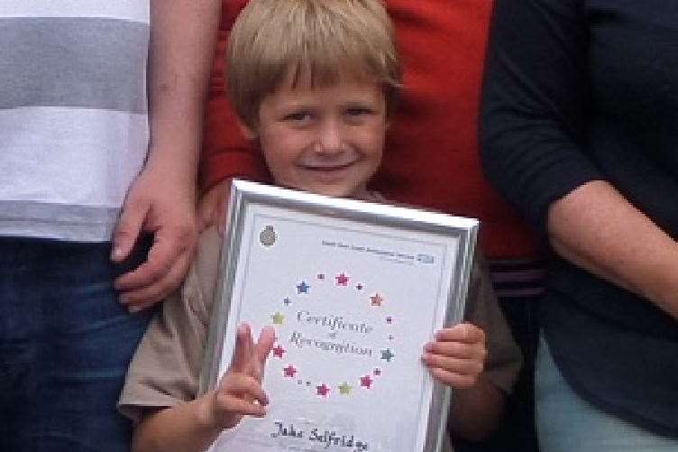 Jake, 6, with his certificate