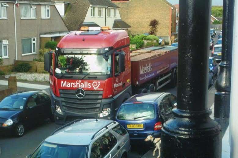 One resident has photographed lorries' attempts in getting past parked cars