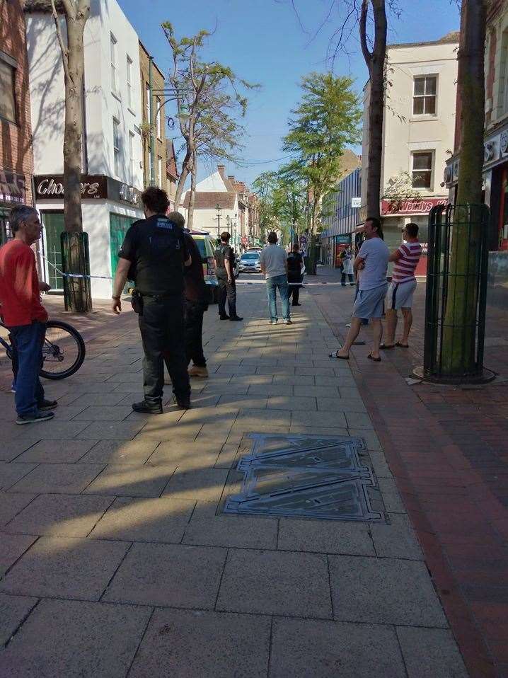 Police stand guard around a cordon in Chatham High Street Picture: Nicola Cochran