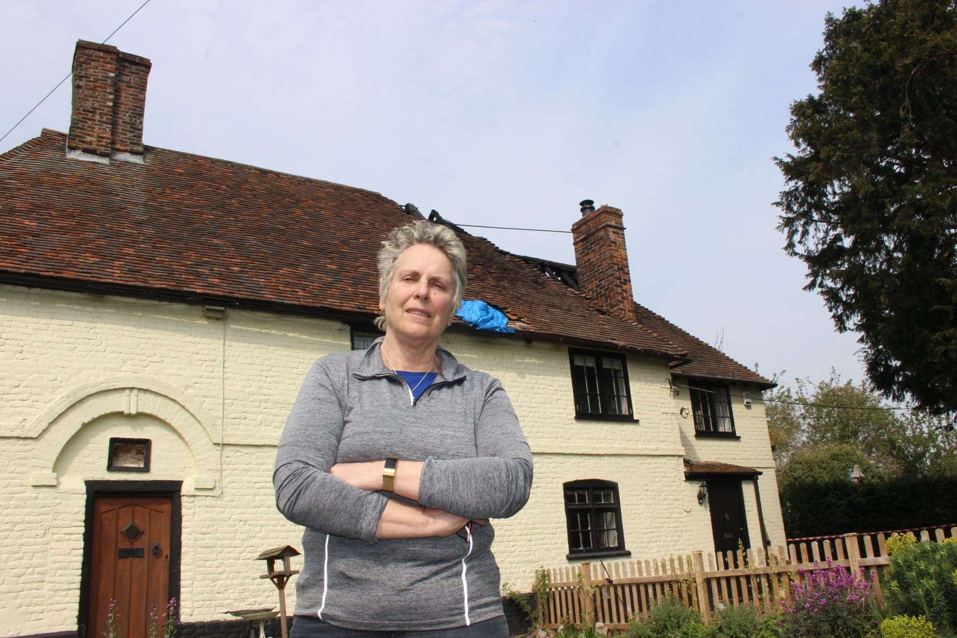 Neighbour Kim Webb outside the fire damaged house in Lynsted Lane, Lynsted (8763568)