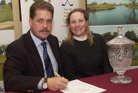 Kent's British Open champion Karen Stupples signs the contract with Chart Hills manager David Walls. Picture: GARY BROWNE