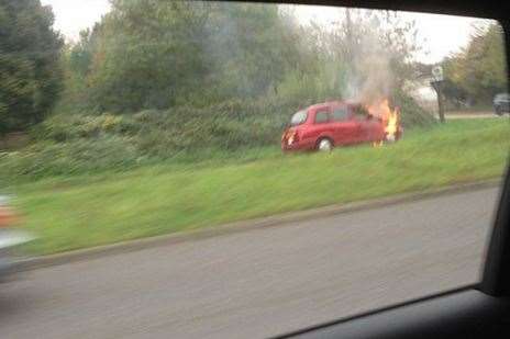 The red taxi alight on Maidstone Road, Chatham.