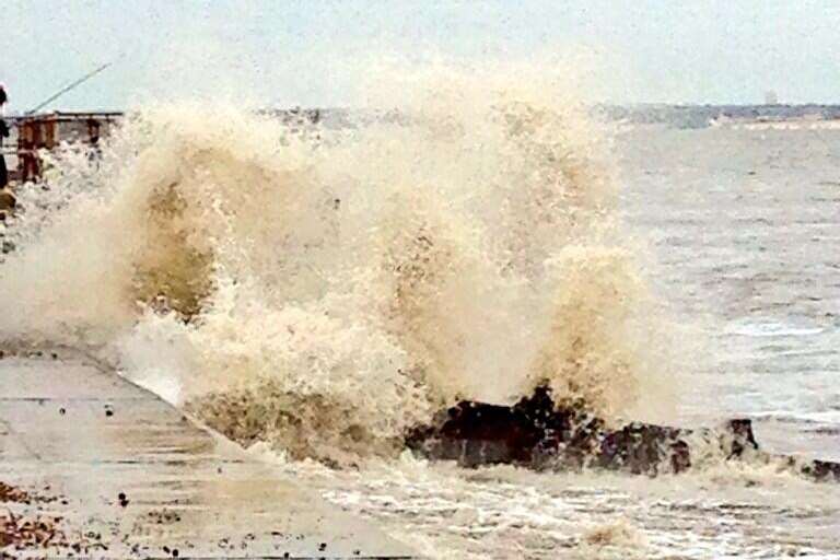 Waves crash against the seafront in a dramatic high tide at Deal beach this afternoon. Picture: Claire Steer