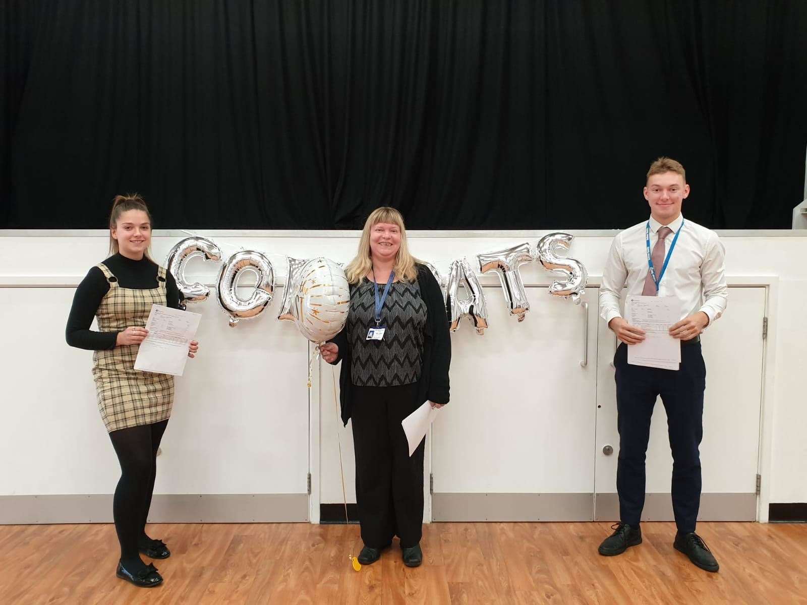 Left: head girl Sam Brown achieved two distinctions, in business and sport; centre: head teacher Tanya Kelvie; right: head boy Joshua Upson who achieved two distinctions in business and ICT and a merit in sport (15319999)