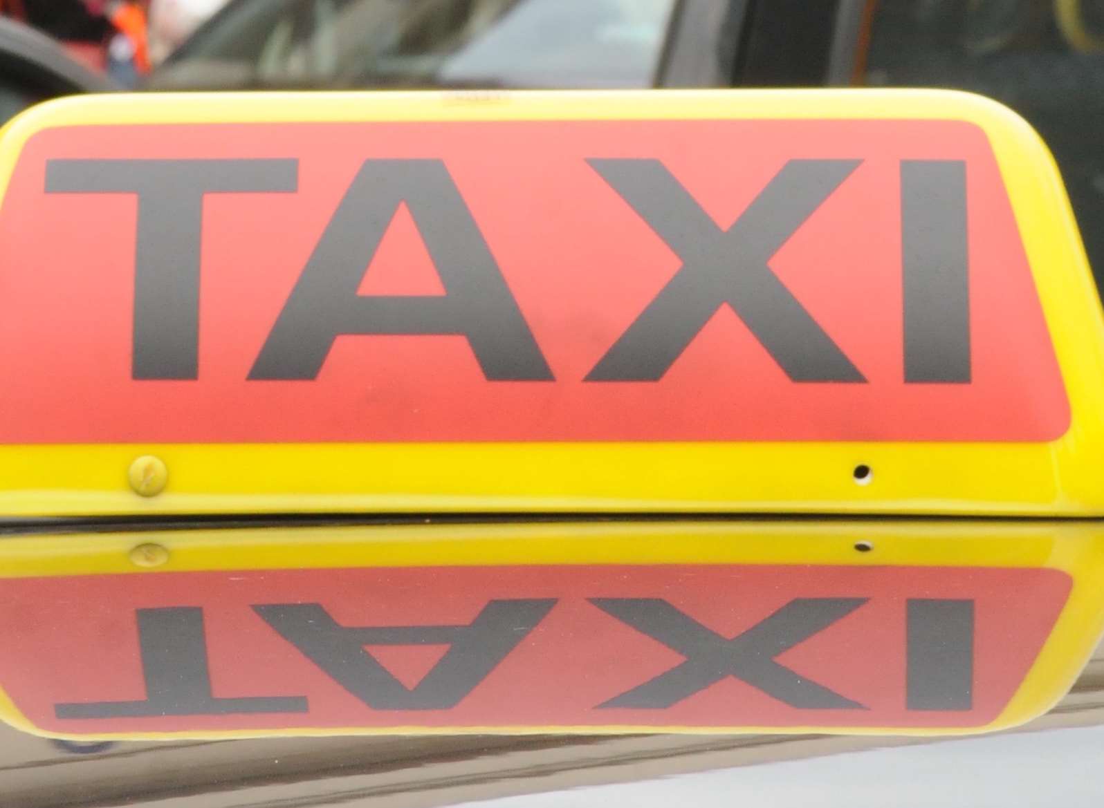 A taxi was used by crooks who conned a woman out of £4,000 in Sittingbourne