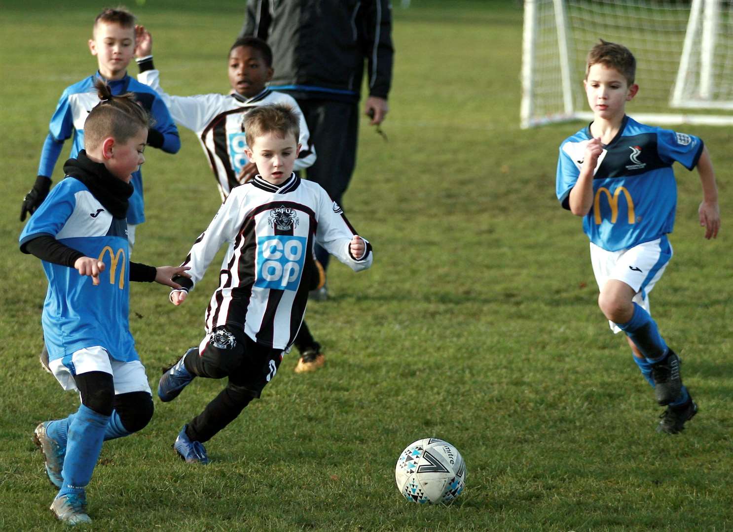 Milton & Fulston United under-7s (stripes) take on Woodpecker Rovers under-7s. Picture: Phil Lee FM23734076