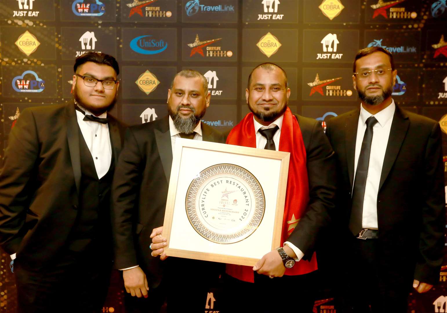 From left to right: Raffe Ahmed, Jalal Ahmed, Jamal Ahmed and Rose Ahmed from Shozna Restaurant with their award. Photo: Curry Life Magazine