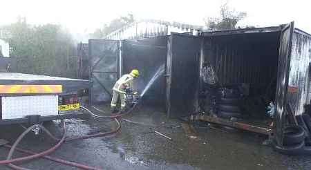 Firefighters bring the blaze under control. Picture: BARRY CRAYFORD