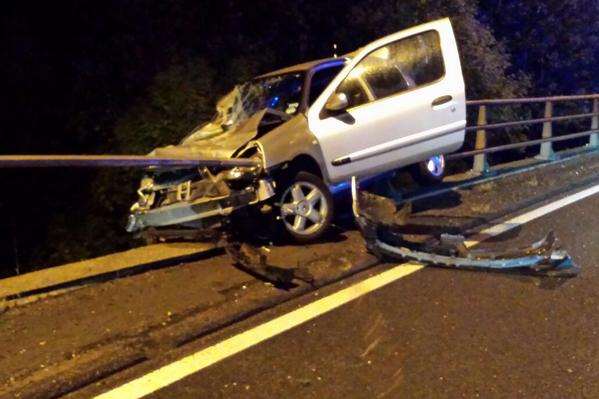 The car was left dangling over the M26 carriageway below. Picture: @kentpoliceroads