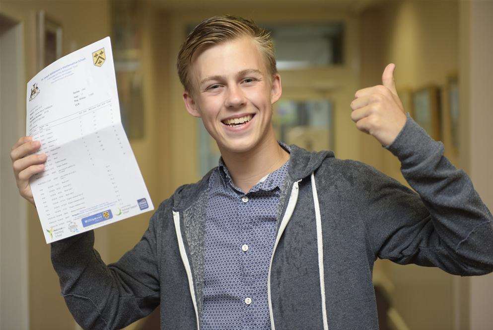 Rochester Math pupil James Parker picks up his results. Library image.