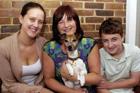 Frankie the Jack Russell, who made a surpirise journey to London, with his family Stephanie Abbott, 22, Jane Abbott and James Jeeves, 14