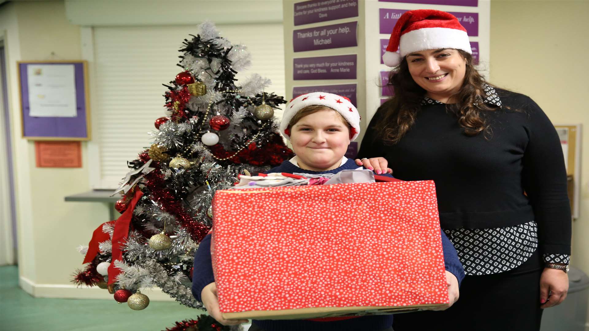 Thomas Bowden, 10, and homeless care manager Zofia Grzymala with just a small amount of Thomas's donations. Picture: Rebecca Holliday