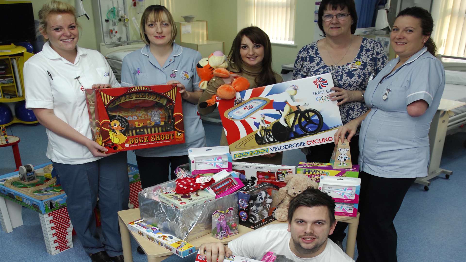 Rob and Emma from Kmfm, deliver toys to the unit in Christmas 2012