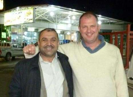 Barry Manners with a shop worker, who he met during his time in captivity, during a visit to Iraq in 2011