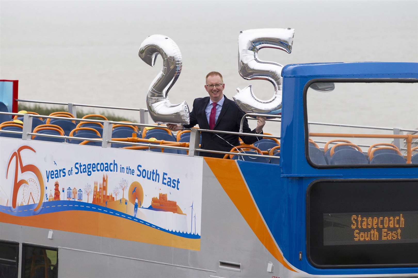 Matthew Arnold, commercial director at Stagecoach South East, celebrating the company’s 25th anniversary with the silver liveried buses (4053559)