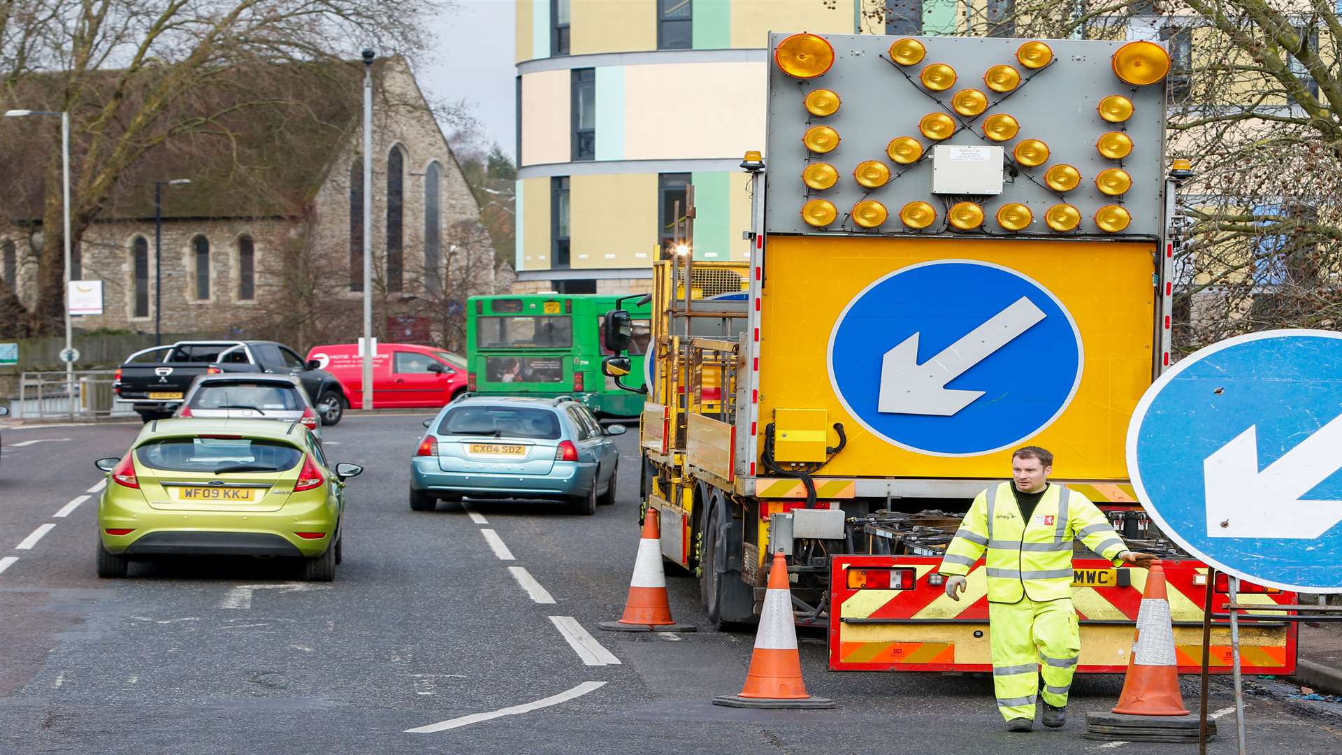 KCC Highways workers put out cones and road signs around Maidstone's gyratory system