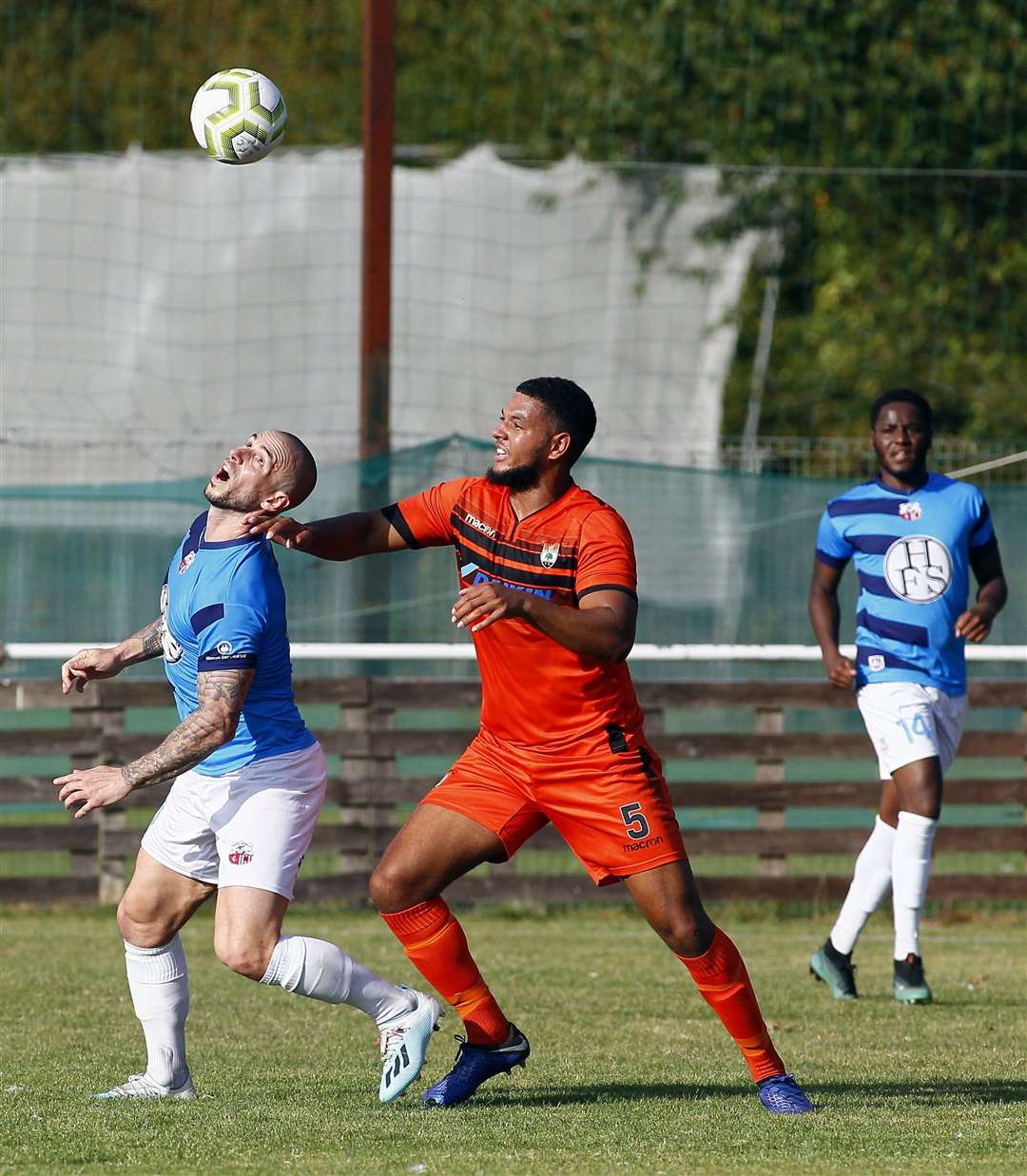 The fan was taken ill just after the football action. Lordswood are in orange, Sheppey in blue. Picture: Sean Aidan