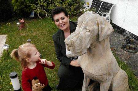 Dianna Dooner and graddaughter madison Maple with the concrete Scooby-Doo which was removed from her front garden
