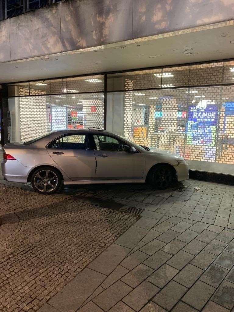 A stolen car was chased by police until it crashed in to a shop shutter in Chatham High Street. Pic: Kent Police (14575939)
