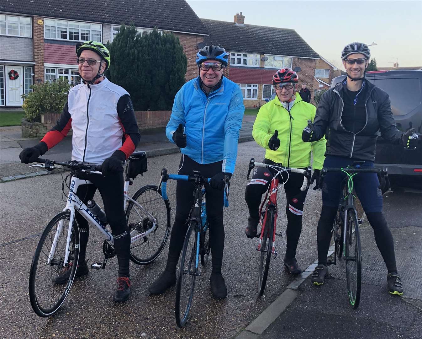 In December, six months to the day doctors told Mark, pictured in blue, he had six months to live he took part in a 75-mile bike ride calling it the 'Not Dead Yet Ride'