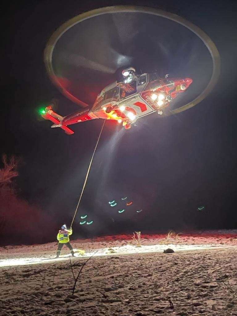 The coastguard helicopter at the scene in Wye last night. Photo: Coastguard