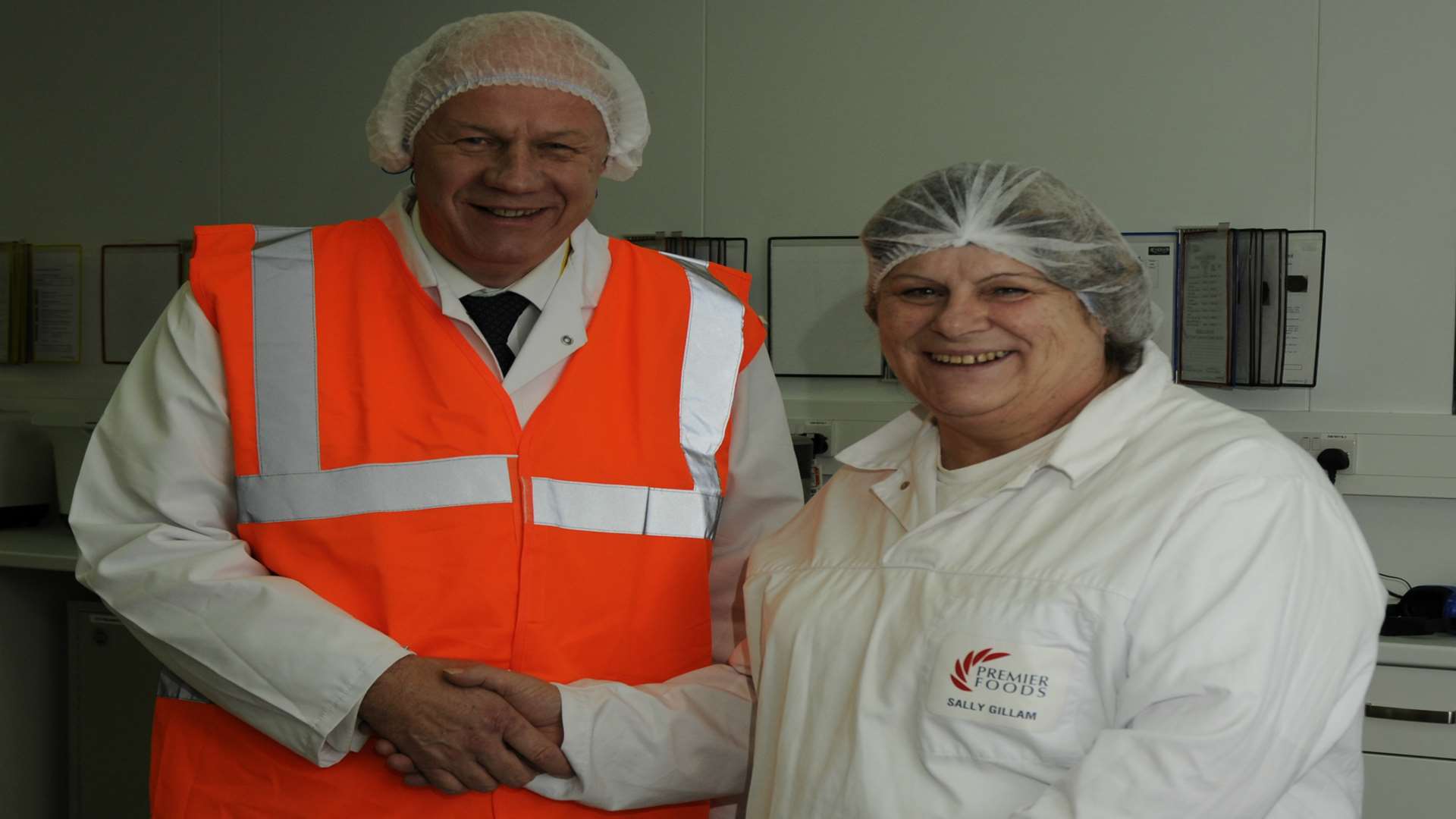 Ashford MP and Work and Pensions Secretary Damian Green congratulates Sally Gillam on 40 years of service at the town's Premier Foods factory