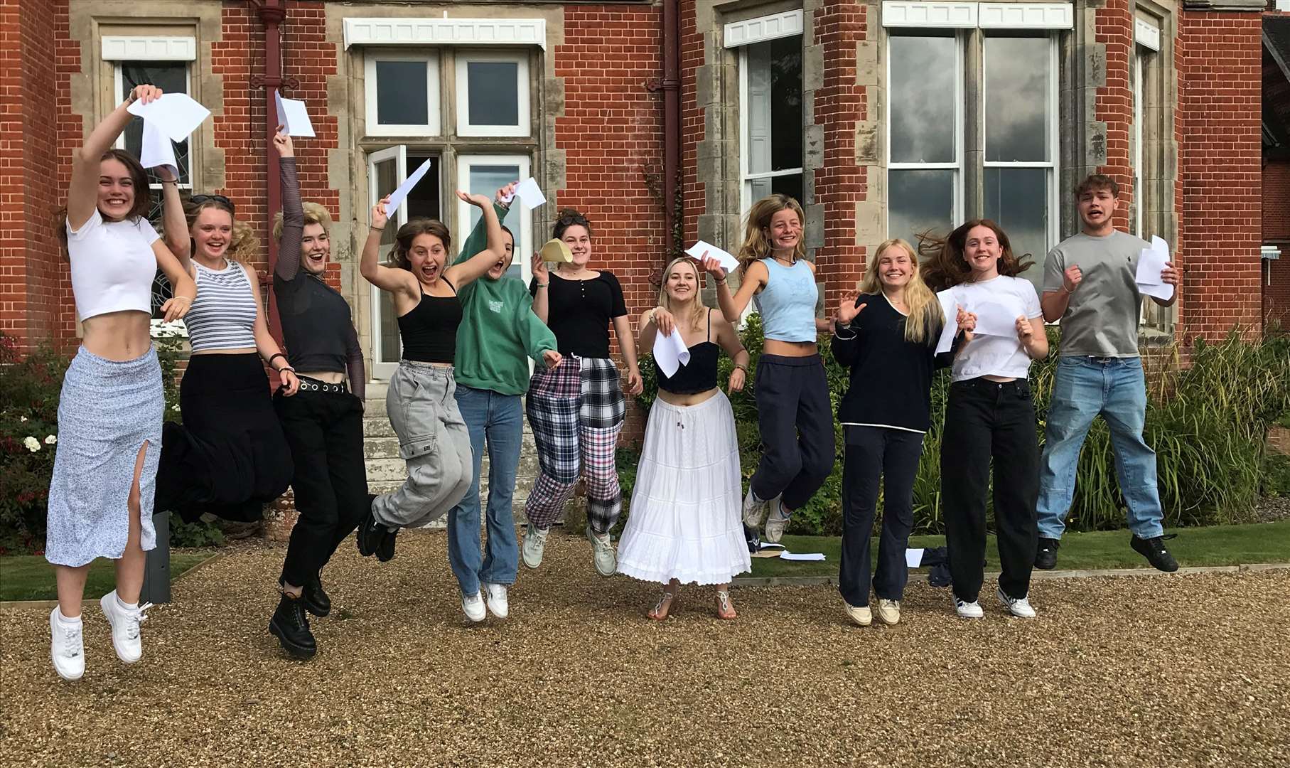 Pupils at Kent College Pembury jumping for joy after receiving their exam results