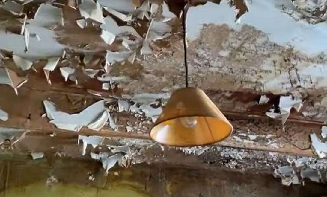 Chipped paint from the kitchen ceiling.  Image: Clive Emson / YouTube
